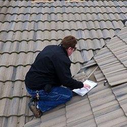 Home inspector inspecting roof